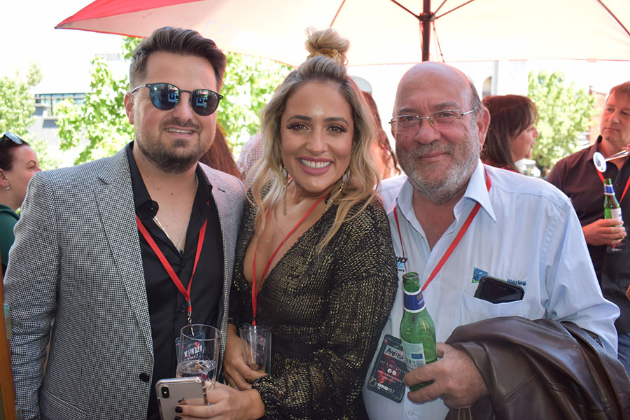 Clients and friends celebrate with Nova 93.7 at their annual Christmas Party on the balcony