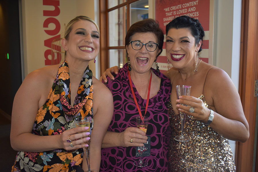 Clients and friends celebrate with Nova 93.7 at their annual Christmas Party on the balcony